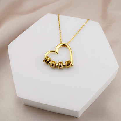 Custom engraved name beads close up - gold finish BondBeads